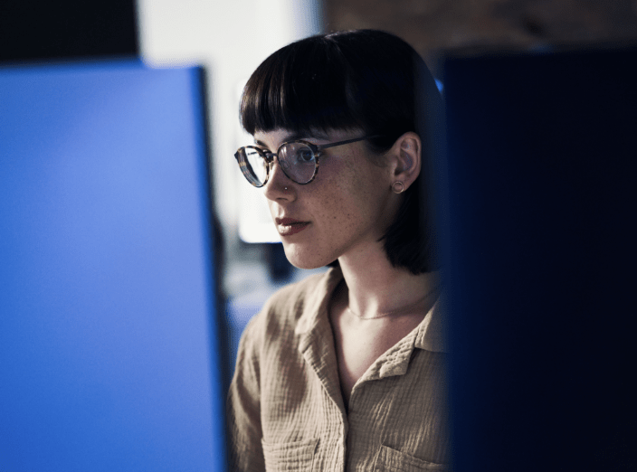 A person looking at a computer screen.