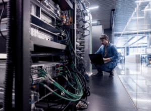 A person working on an IT server setup.