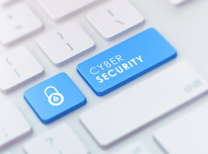 A keyboard zoomed in on two blue keys, one with a lock symbol, and one that says Cyber Security.