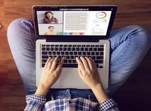 An overhead view of a person working with a laptop in their lap.