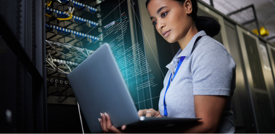 A woman working on a laptop.