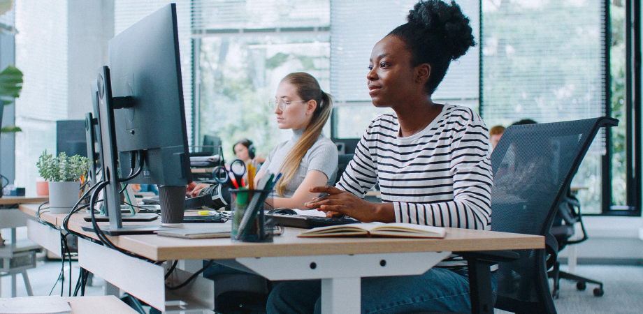 Two people working in an office environment.